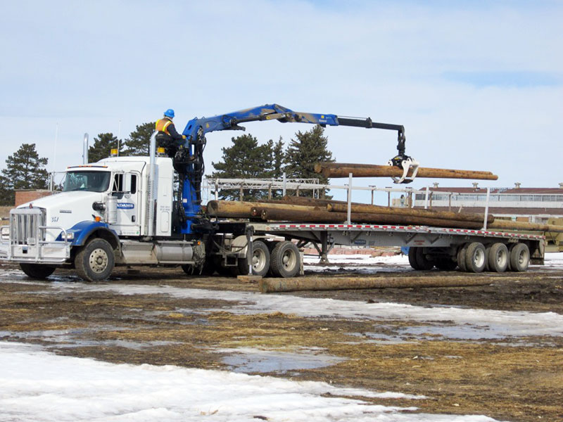 Adams Industries truck loading wood